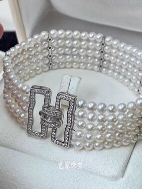 White Pearl Multi-Strand Bracelet with Crystal Clasp